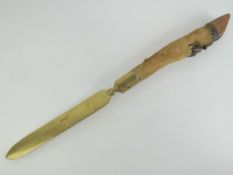 A decorative brass knife having deer slot handle measuring 57cm in length.