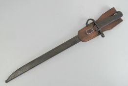 A WWII Japanese Arisaka bayonet, 39.5cm blade, with scabbard and leather frog.