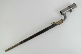An 1853 pattern Martini Henry socket bayonet with leather and brass scabbard.