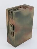 A WWII German 20mm Pak 37 magazine in camouflage painted tin.