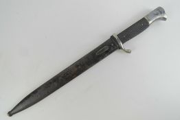 A WWII German K98 Parade bayonet and scabbard, marked Alcoso Solingen to the 25cm blade.