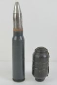 An inert 20mm Vulcan cannon round, together with an inert Czech made rubber grenade.