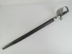 An 1871 pattern Naval cutlass, having inspection marks upon, 65.5cm blade, with leather scabbard.