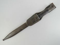 A WWII German K98 bayonet with 24.5cm blade marked E.Pack & S 1299, with scabbard made by E.u.F.