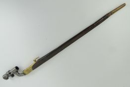 An 1876 pattern Mk2 Martini Henry bayonet with leather and brass scabbard.