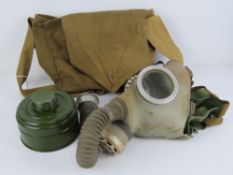 A Russian gas mask with canister and bag.