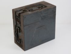 An unusual WWII German hinged lidded ammo box dated 1942 and having German marks upon.