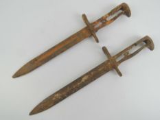 Two M1 Garand bayonets in relic condition.