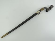 An 1853 British socket bayonet having inspection marks upon with leather and brass scabbard.