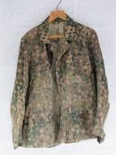 A reproduction WWII German SS dot camouflage tunic.