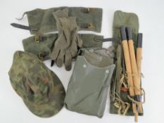 A quantity of assorted reproduction WWII German items; double sided SS camo cap, gloves,