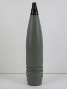 An inert British 76mm shell head with fuse standing 40cm high.