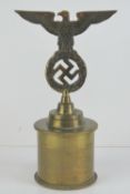A large German trophy having 1917 brass shell case base with eagle and swastika over, 13cm dia base,