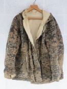 A reproduction WWII German SS camouflage jacket.