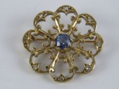 A 9ct gold floral Edwardian style brooch having central cornflower blue sapphire approx 0.4ct (4.
