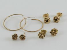 Two pairs of hallmarked 9ct gold stud earrings being an abstract floral pair and a Celtic knot pair,