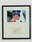 Ayrton Senna; hand-signed autograph on card in photographic montage. Measuring 36 x 30cm.