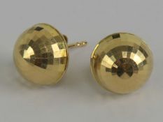 A pair of 14ct gold earrings in the form of semi-hemispherical disco balls, each stamped 14k.