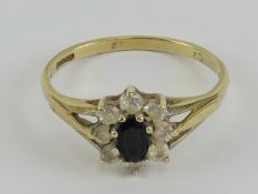 A 9ct gold sapphire and cz floral cluster ring, hallmarked 375, size O, 1.9g.