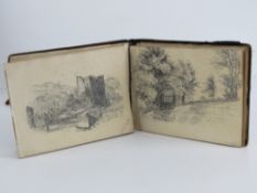 A small book containing a quantity of delightful amateur sketches of rural scenes, churches, houses,