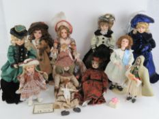 A quantity of assorted contemporary porcelain and bisque headed dolls.