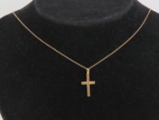 A 9ct gold crucifix on 9ct gold fine chain, pendant 2.