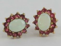 A pair of 9ct gold opal and ruby stud earrings,