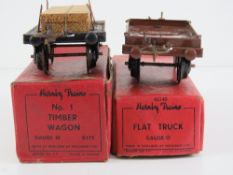 A Hornby trains 0 gauge flat truck together with a number one timber wagon,