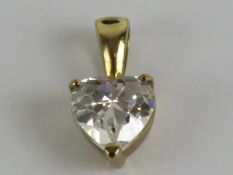 A 9ct gold white stone pendant in the form of a heart, stamped 375, 12mm in length, 0.8g.