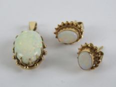 To match above Lot; a 9ct gold opal pendant, red/green fire, with associated stud earrings.