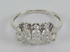 A 9ct white gold ring having five pairs of round cut cz stones, hallmarked 375, size T-U, 3.