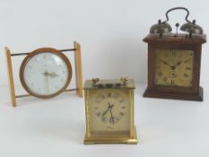 A Smiths eight day floating balance clock, together with a brass Avia Carriage clock,