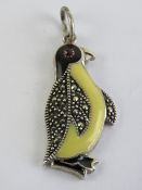 A 925 silver marcasite and enamel pendant in the form of a penguin, 3.5cm in length inc bale.
