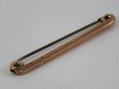 A 9ct rose gold Victorian bar brooch or stock pin, 4cm in length, 0.8g.