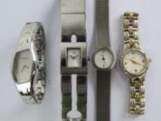 Ladies designer watches; Kenneth Cole, Anne Klein, DKNY and Storm. Four items.