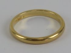 A yellow metal ring, no apparent hallmark, size J, 2g.