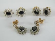 Two pairs of 9ct gold sapphire daisy cluster earrings,
