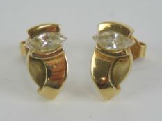 A pair of 9ct gold stud earrings each having marquis shaped cz stone upon,