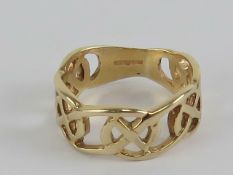 A 9ct gold ring having Celtic cross pattern, hallmarked 375, size Q-R, 4.4g.