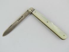 A hallmarked silver fruit knife having mother of pearl handle, hallmarked Sheffield 1895.