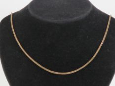 A 9ct gold woven chain necklace measuring 62cm in length, hallmarked London, 10.5g.