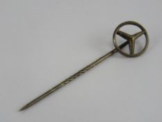 A white metal Mercedes tie pin.