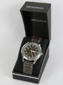 A Sekonda wristwatch having bronze coloured dial with date aperture, upper leather strap,