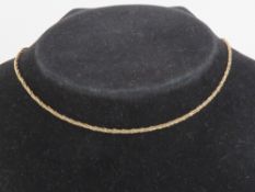 A 9ct gold woven chain necklace, hallmarked 375 and measuring 36cm in length. 3.8g.