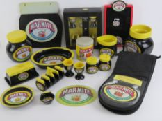 A quantity of Marmite-themed ceramic ware inc jars, jugs, plates, butter dish and cover, toast rack,