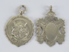 Two HM silver fob medallions, one of shield form and one with football player to front,