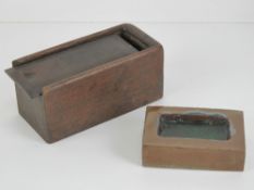 A handmade and glazed smokers receptacle in the form of a recessed brick, 8cm in length.