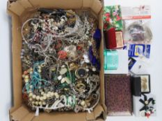 A large quantity of assorted costume jewellery including; rings, glass bead necklaces, bangle,