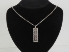 A HM silver ingot pendant with HM silver chain, ingot hallmarked London 1977, total weight 1.26ozt.