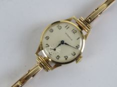 A 9ct gold Rodania ladies wristwatch on 9ct gold expanding bracelet strap, Swiss manual movement,